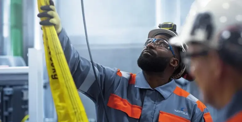 A Wärtsilä employee at work in a facility. 