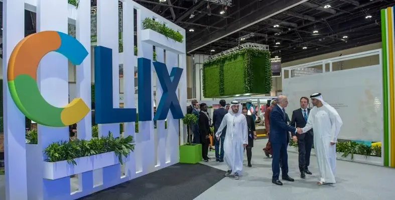 Attendees at a previous WFES around a CLIX banner. 
