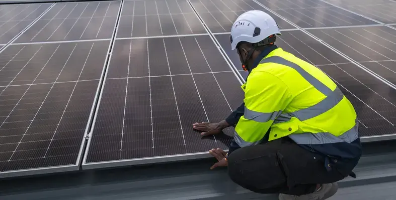 Solar_panel_technician_at_work